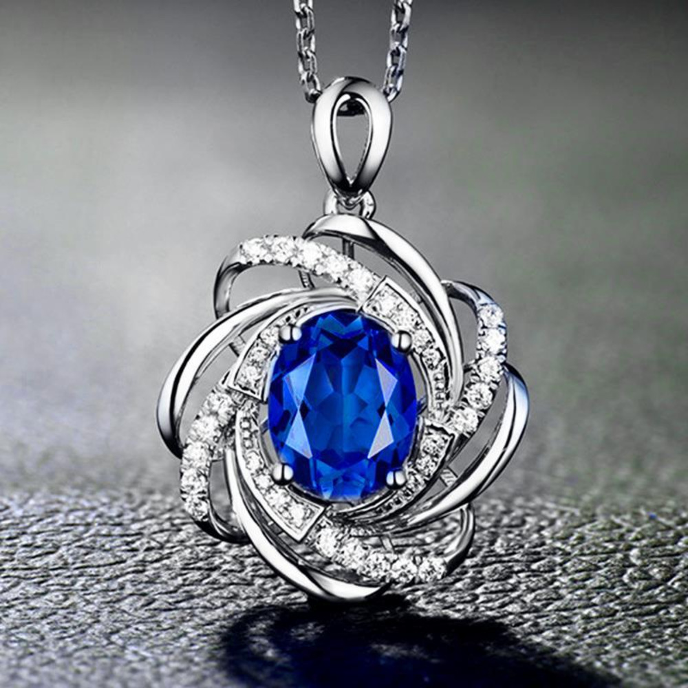 Feminine Fashion Necklace with faux gems in blue with silver tone hardware